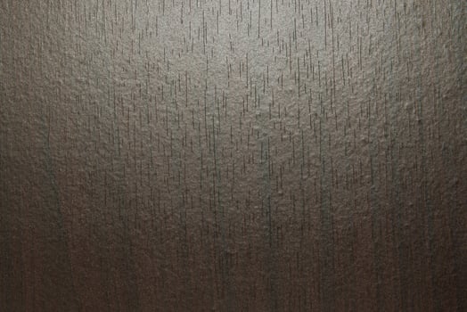 Abstract dark texture of MDF wood board background. Spotlight on dark background for your design. photo