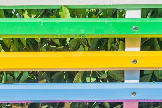 Bright colorful decorative fence. Abstract multicolored background photo