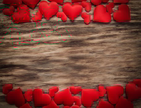 Red hearts on a wooden background photo