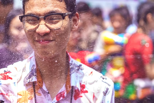Siam Square, Bangkok, Thailand - APR 13, 2019 short action of people joins celebrations of the Thai New Year or Songkran in Siam Square. photo