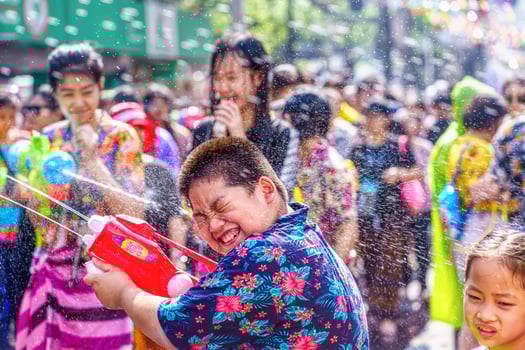Siam Square, Bangkok, Thailand - APR 13, 2019 short action of people joins celebrations of the Thai New Year or Songkran in Siam Square. photo