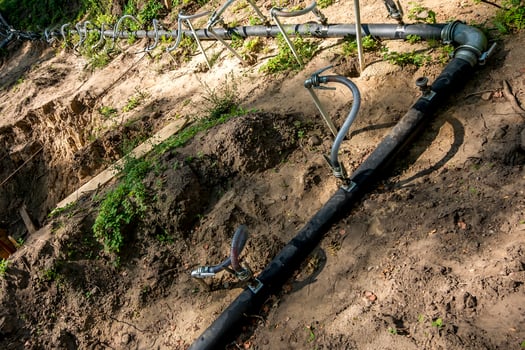 pumping station. groundwater drainage system pumps water out of the ground. dehydration gravel rural route photo