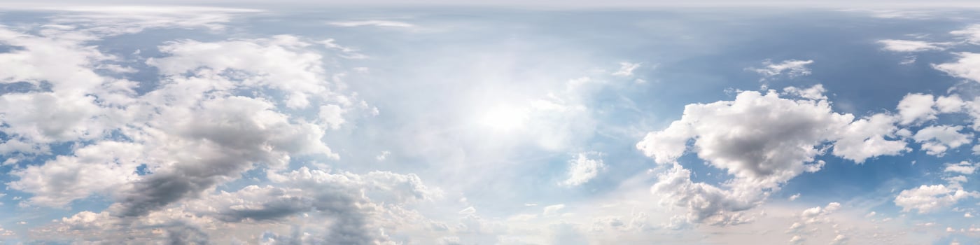 Seamless cloudy blue sky hdri panorama 360 degrees angle view with zenith and beautiful clouds for use in 3d graphics as sky dome or edit drone shot photo