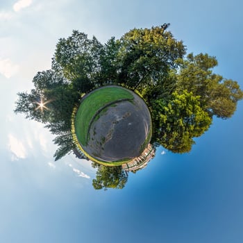 Little planet transformation of spherical panorama 360 degrees. Spherical abstract aerial view in field in nice evening with awesome beautiful clouds. Curvature of space. photo