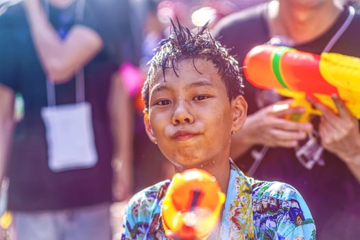 Siam Square, Bangkok, Thailand - APR 13, 2019 short action of people joins celebrations of the Thai New Year or Songkran in Siam Square. photo