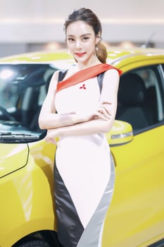 Nonthaburi, Thailand - DEC 3, 2019 Unidentified model poses with a car at The 36th Motor Expo Thailand 2019 at IMPACT Arena, Muang Thong Thani, Nonthaburi, Thailand. photo
