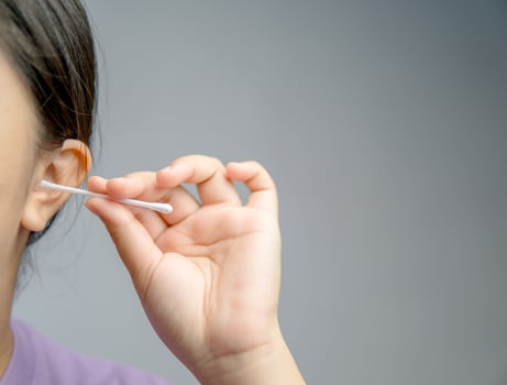 Asian woman cleaning her ears photo