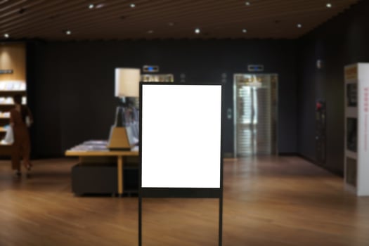 Advertising poster board inside department store photo