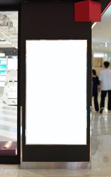 Advertising poster board inside department store photo