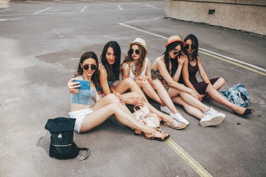 Five beautiful young girls relaxing photo