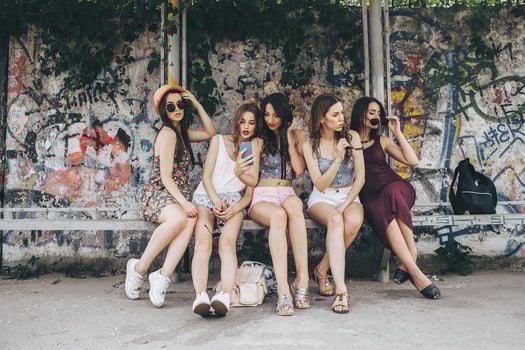 Five beautiful young girls relaxing photo