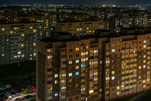 Night panorama of Light in the windows of a multistory building. life in a big city photo
