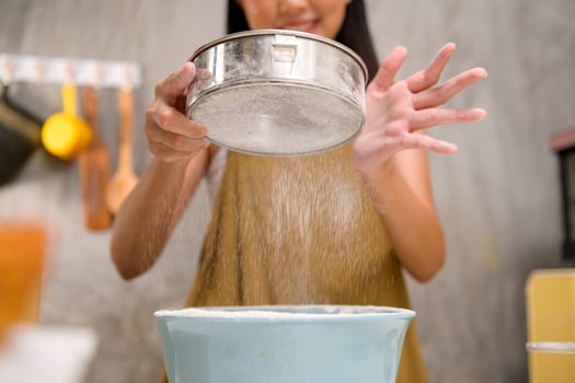 Close up of Young beautiful woman is baking in her kitchen , bakery and coffee shop business photo