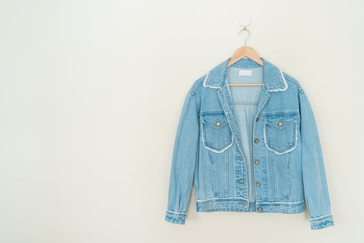 woman jacket jean hanging on wall photo