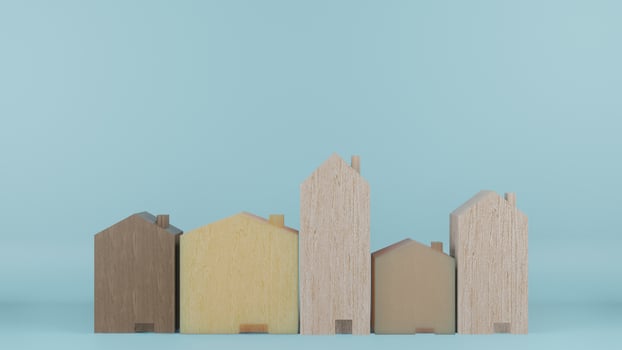 The  multi size  wooden homes toy on blue colour background 3d rendering photo