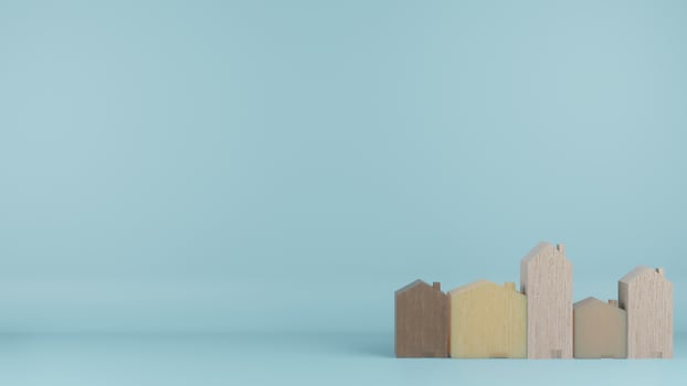 The  multi size  wooden homes toy on blue colour background 3d rendering photo