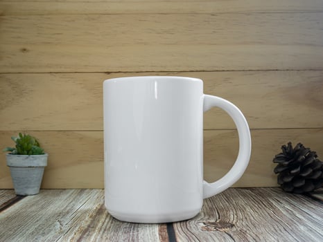 white mug on table wood for mockup or background photo
