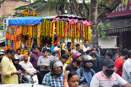 New Delhi, India July 01 2022 - A huge gathering of devotees from different parts of Delhi on the occasion of ratha yatra or rathyatra. Rath for Lord Jagannath pulled by people, Jagannath Rath Yatra photo