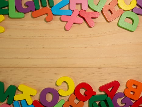 The alphabet multicolor  on wood table for education or kid concept photo