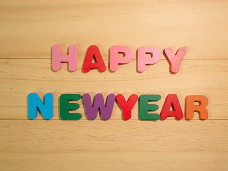The happy new year on  wood texture for background concept photo