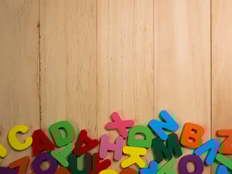 wood alphabet multi color on table for education or kid concept photo