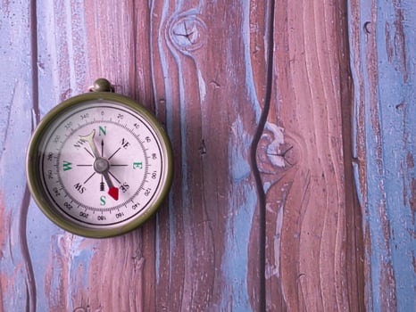 compass on wood table for tourist or travel concept photo