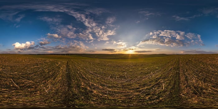 full seamless spherical hdri panorama 360 degrees angle view among fields in evening sunset with awesome blue pink red clouds in equirectangular projection, ready for VR AR virtual reality photo