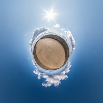 Little planet transformation of spherical panorama 360 degrees. Spherical abstract aerial view in field with awesome beautiful clouds. Curvature of space. photo