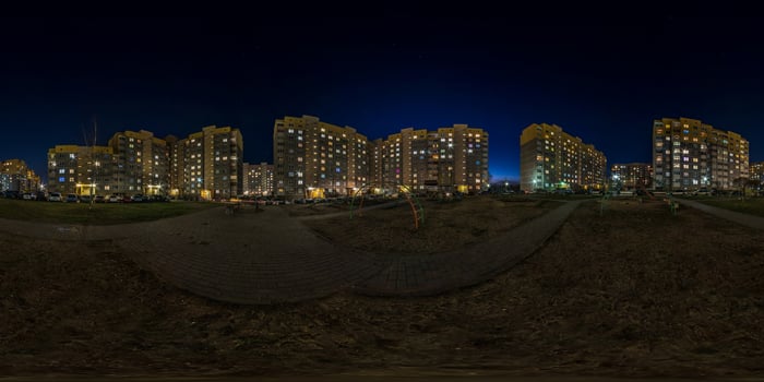 full seamless spherical hdri night panorama 360 on empty street of multistory buildings residential quarter with light in windows in equirectangular projection. social distancing concept. quarantine photo