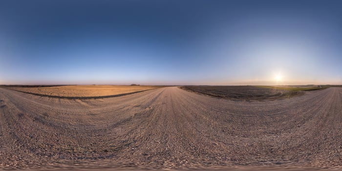 full seamless spherical hdr panorama 360 degrees angle view on no traffic gravel road among fields in spring evening with clear sky in equirectangular projection, for VR AR virtual reality content photo