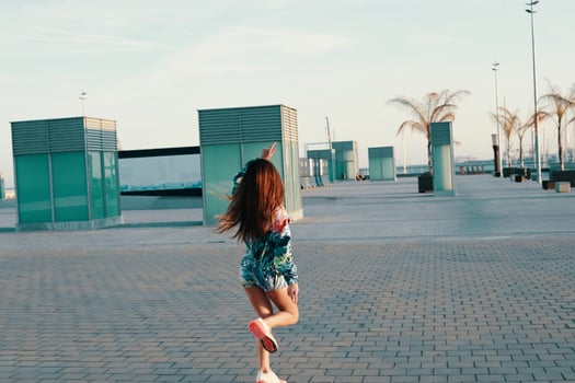 Attractive young woman feeling free while running outdoors photo