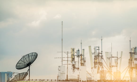 Telecommunication equipment for 5g radio network. Telecommunication tower, antenna, and satellite dish. Antenna for wireless network. Broadcasting tower for internet communication. Broadcast antenna. photo