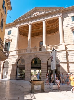 Small fountain in front of building photo