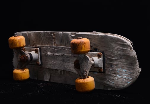 Old worn skateboard photo