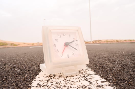Clock on the road photo