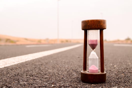 Hourglass on the ground photo