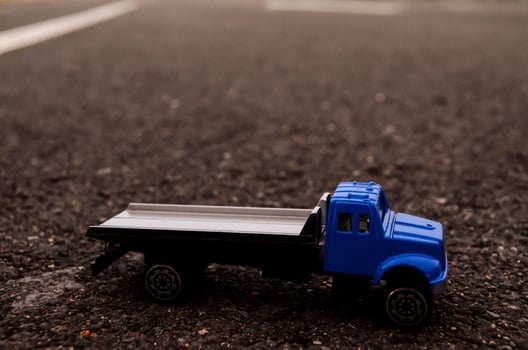 Toy truck on the road photo