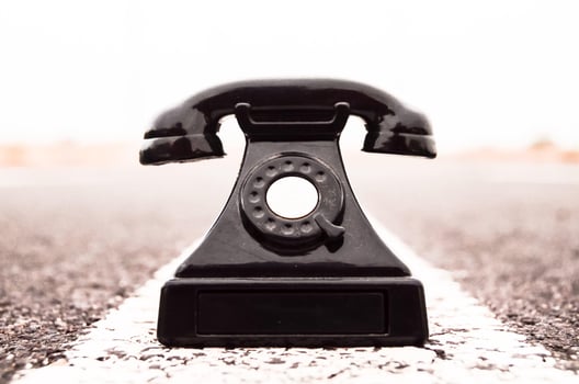 Old telephone on the road photo