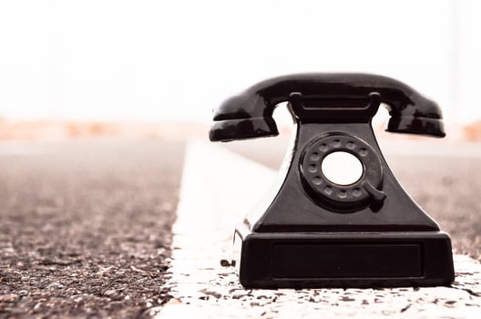 Old telephone on the road photo