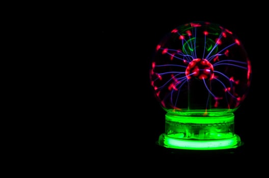 Magic ball on black background photo