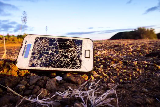 Broken phone on he ground photo
