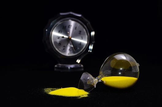 Broken hourglass close-up photo