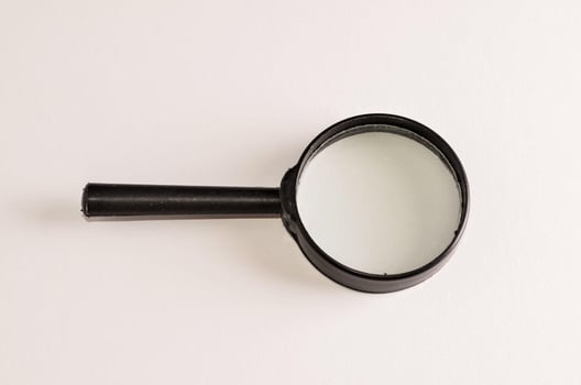 Isolated magnifying glass photo