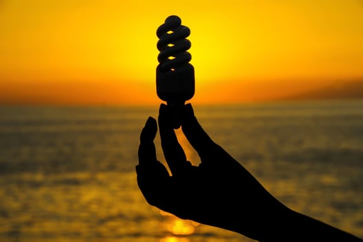 Light bulb over the sunset photo
