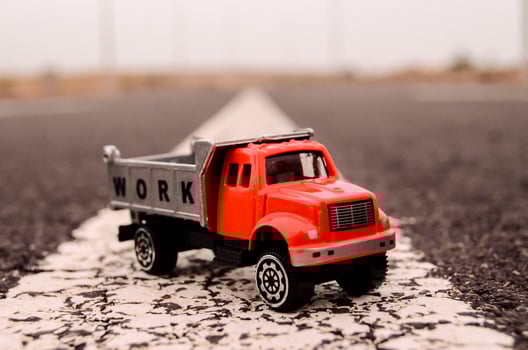 Toy truck on the road photo