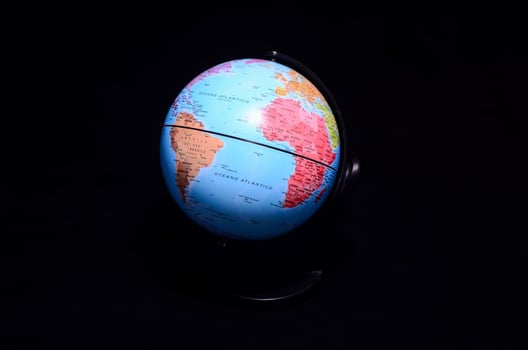 Globe on black background photo