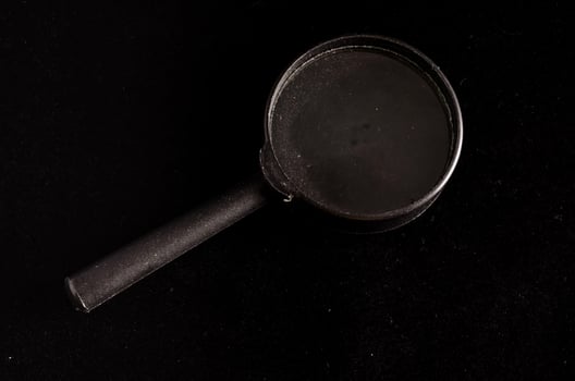 Isolated magnifying glass photo