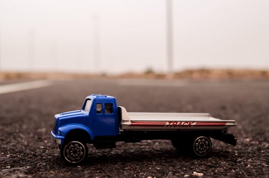 Toy truck on the road photo