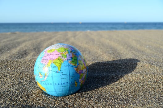 Globe in the sand photo