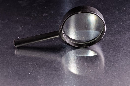 Isolated magnifying glass photo